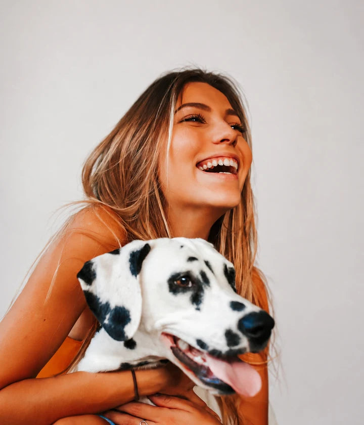 Photo of a woman hugging her dalmatian, uploaded for a custom manga T-shirt